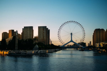 ferris wheel over body of water ferris wheel over body of water