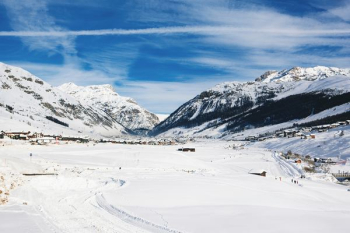 field covered with snow under blue sky field covered with snow under blue sky