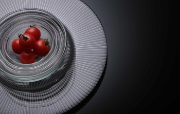 Five Tomatoes on Clear Glass Bowls Five Tomatoes on Clear Glass Bowls