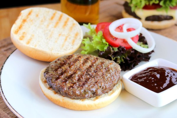 Flame Broiled Hamburger With Garnishes Flame Broiled Hamburger With Garnishes
