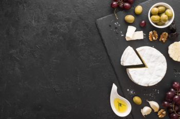 Flat lay cheese composition with copy space Free Photo Flat lay cheese composition with copy space Free Photo