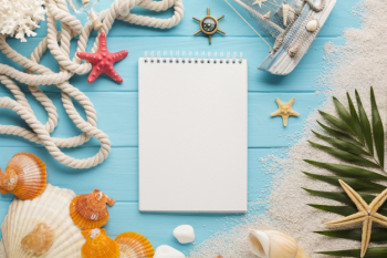 Flat lay notebook with beach concept Free Photo