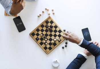 Flat Lay Photography of Two Men Playing Chess