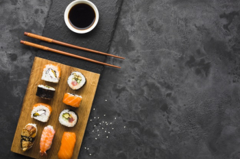 Flat lay sushi arrangement on slate background Free Photo Flat lay sushi arrangement on slate background Free Photo