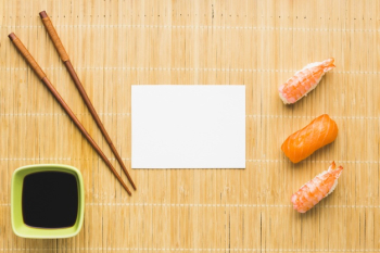 Flat lay sushi arrangement with copy space Free Photo