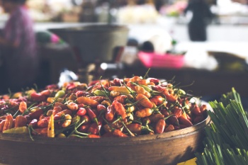 Focus Photo of Round Brown Wooden Bowl Filled With Chili Lot