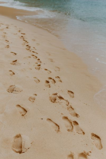 Footprints on a sandy beach, Portugal Footprints on a sandy beach, Portugal