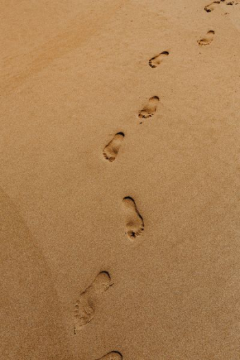 Footprints on a sandy beach, Portugal Footprints on a sandy beach, Portugal