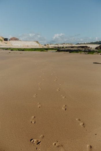 Footprints on a sandy beach, Portugal Footprints on a sandy beach, Portugal