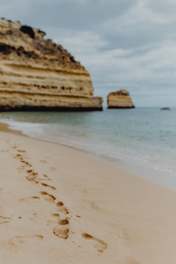 Footprints on a sandy beach, Portugal Footprints on a sandy beach, Portugal