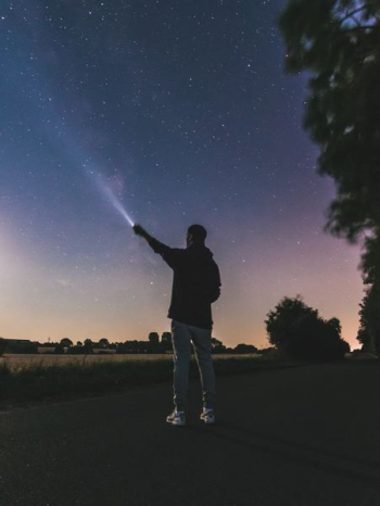 force photography standing man using flashlight at star force photography standing man using flashlight at star