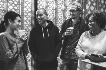 Four People Smiling Grayscale Photo Four People Smiling Grayscale Photo