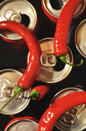 Four Red Chili on Top of Cans Four Red Chili on Top of Cans
