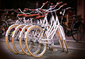 Four White Step-through Bicycles Four White Step-through Bicycles