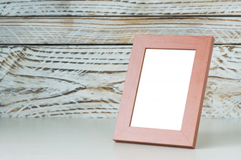 Frame on wood table Frame on wood table
