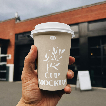 Free Big Paper Cup in Hand Mockup