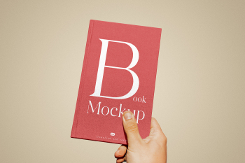 Free Book Cover in Hand Mockup Free Book Cover in Hand Mockup