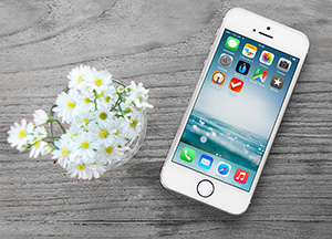 Free iPhone Mockup with Wooden Background Free iPhone Mockup with Wooden Background