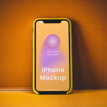 Free iPhone on Concrete Wall Mockup