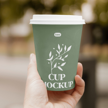 Free Paper Cup in Hand Mockup Free Paper Cup in Hand Mockup