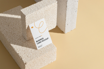 Free Vertical Business Card with Brick Mockup Free Vertical Business Card with Brick Mockup