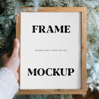 Free Wooden Frame in Hand Mockup