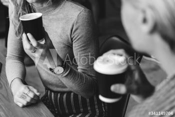 Friends enjoying a hot coffee together Friends enjoying a hot coffee together