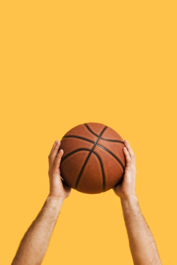Front view of basketball held up by male player Free Photo Front view of basketball held up by male player Free Photo