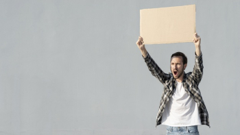 Front view protester holding board with mock-up Free Photo