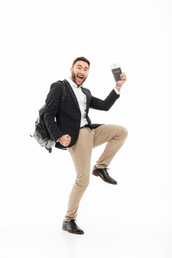 Full length portrait of a joyful excited man holding passport Free Photo Full length portrait of a joyful excited man holding passport Free Photo