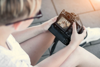 Girl holding a Canon EOS 80D