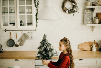 Girl Holding A Little Christmas Tree Decor Girl Holding A Little Christmas Tree Decor