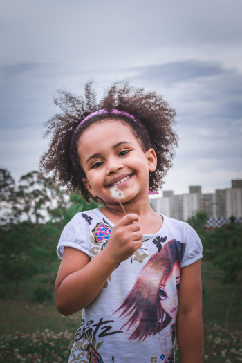 Girl Holding Dandelion Flower Girl Holding Dandelion Flower
