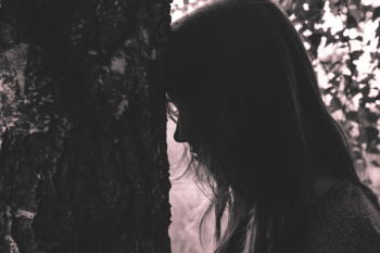 Girl leaning against the tree Girl leaning against the tree