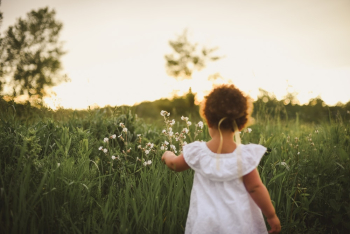 Girl Standing Beside White Flower Field Girl Standing Beside White Flower Field