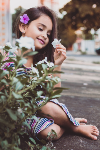 Girl Wearing Multicolored Stripe Dress Girl Wearing Multicolored Stripe Dress