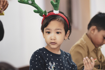 Girl Wearing Reindeer Headband Girl Wearing Reindeer Headband
