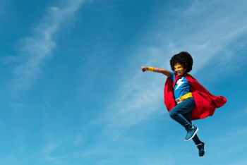 Girl with afro playing superhero Girl with afro playing superhero