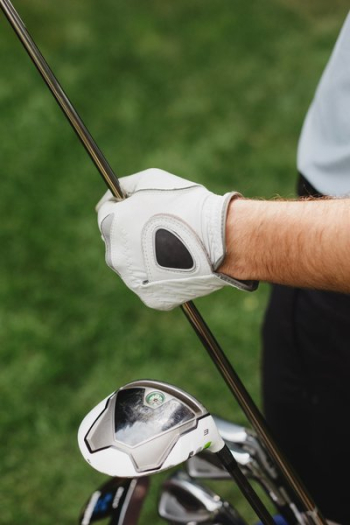 Golfer Holds Club With Gloves Golfer Holds Club With Gloves