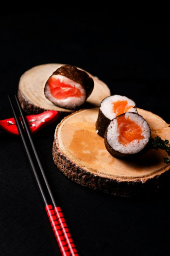 Gourmet Sushi Rolls on Wooden Platter Gourmet Sushi Rolls on Wooden Platter
