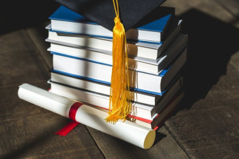 Grad Cap Diploma And Books Stacked Grad Cap Diploma And Books Stacked