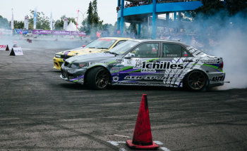 Gray and White Racing Car Drifting Gray and White Racing Car Drifting