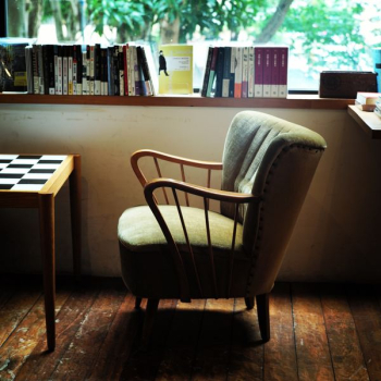 gray armchair near window gray armchair near window