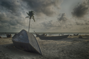 Gray Boat on Gray Sand Beach Under Gray Cloudy Sky