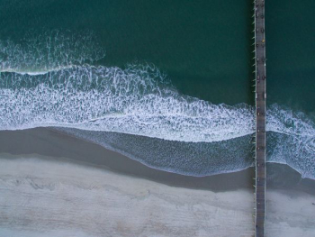 gray bridge on ocean water gray bridge on ocean water