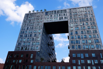 Gray Building Under Cloudy Sky Gray Building Under Cloudy Sky