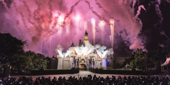 gray castle with fireworks during night time photography gray castle with fireworks during night time photography