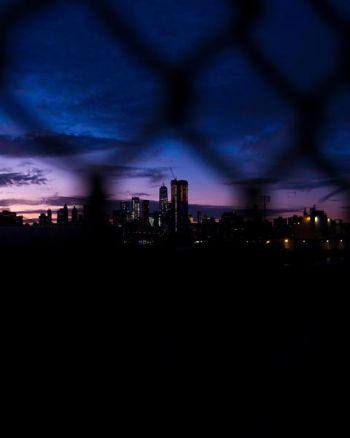 gray chain fence displaying cityscape gray chain fence displaying cityscape