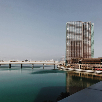 Gray Concrete Building Beside Water