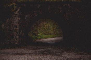 gray road in black concrete brick tunnel gray road in black concrete brick tunnel